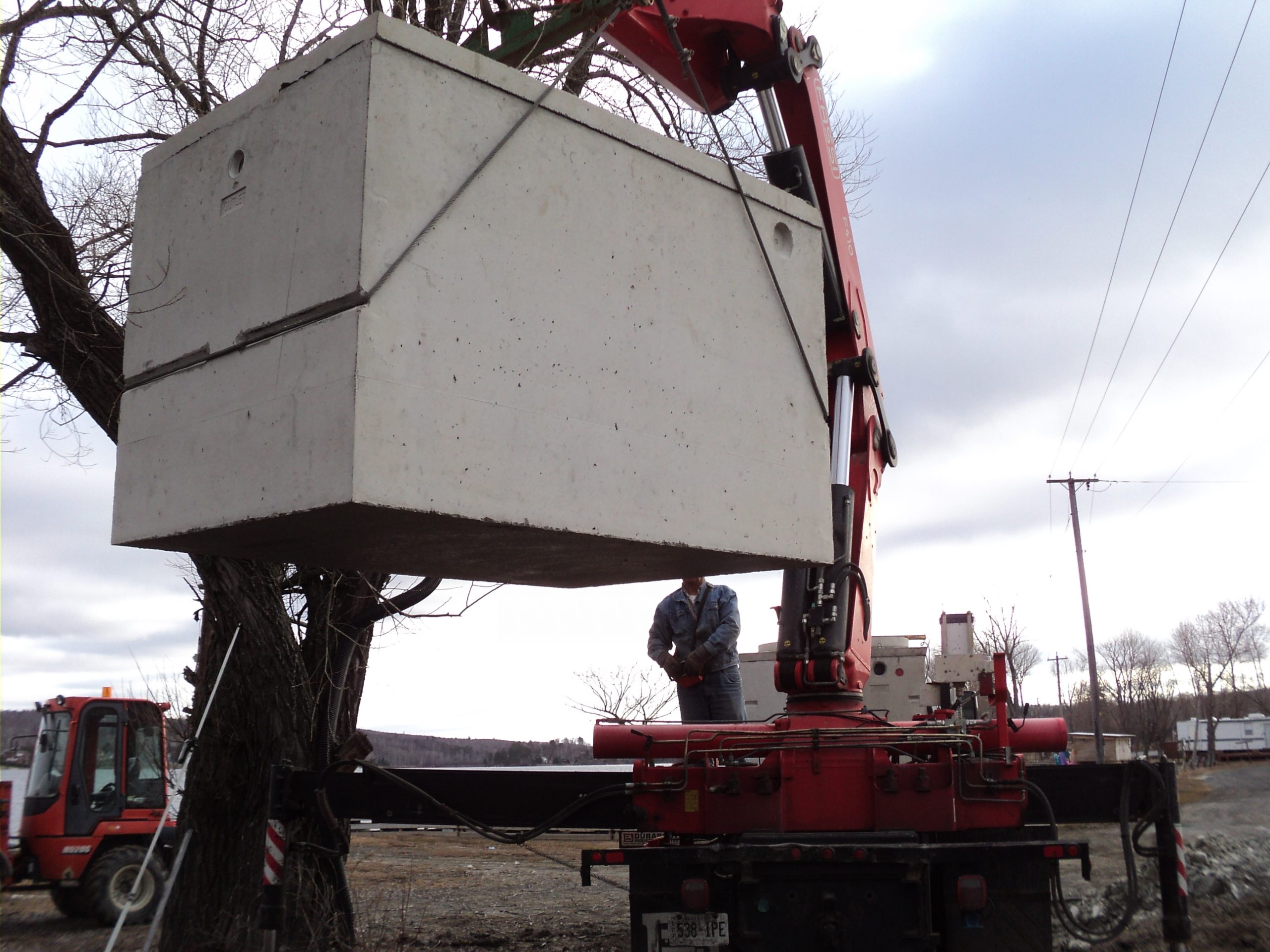 Concrete Septic Tank being unloaded by Contact Canadian Shield Consultants Agency